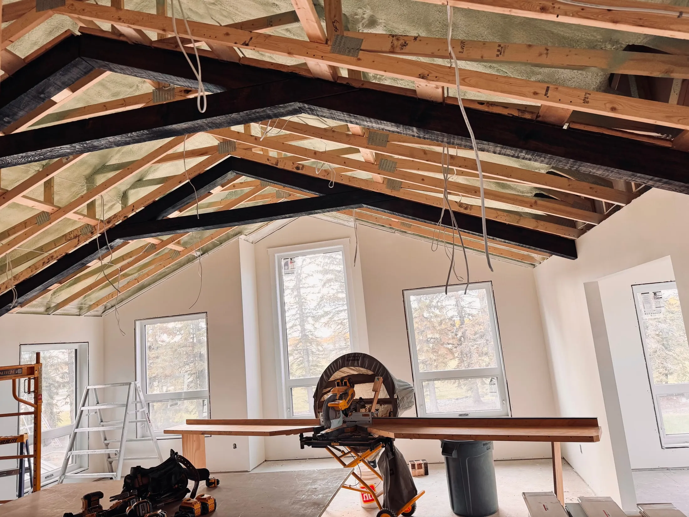 Interior framing and beam work during a Woodwright construction project