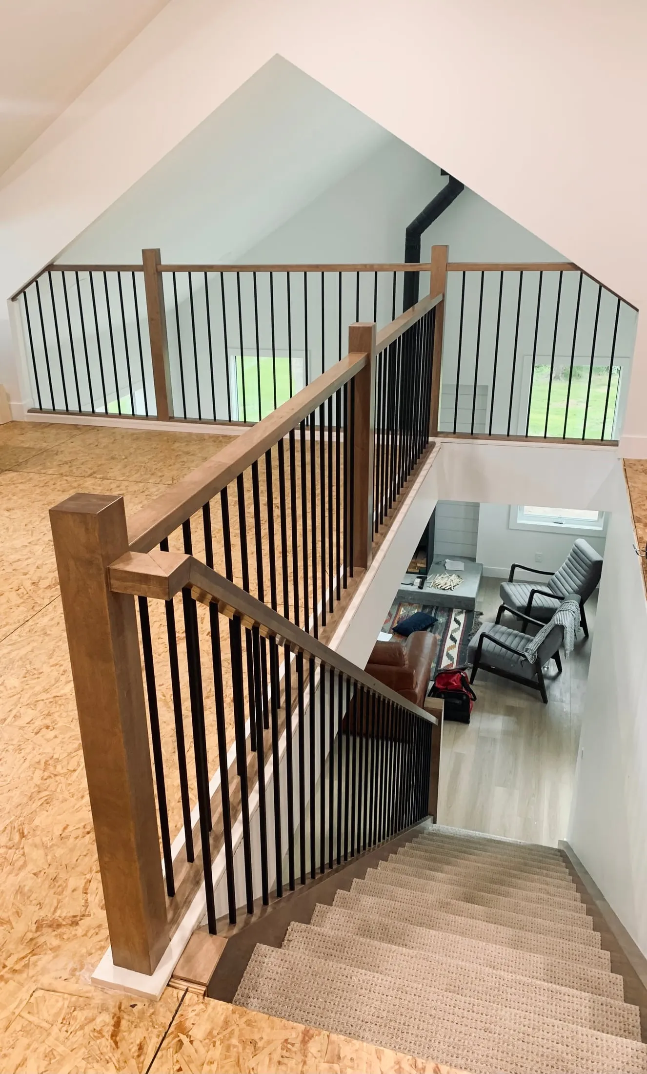 Loft railing looking down over the staircase